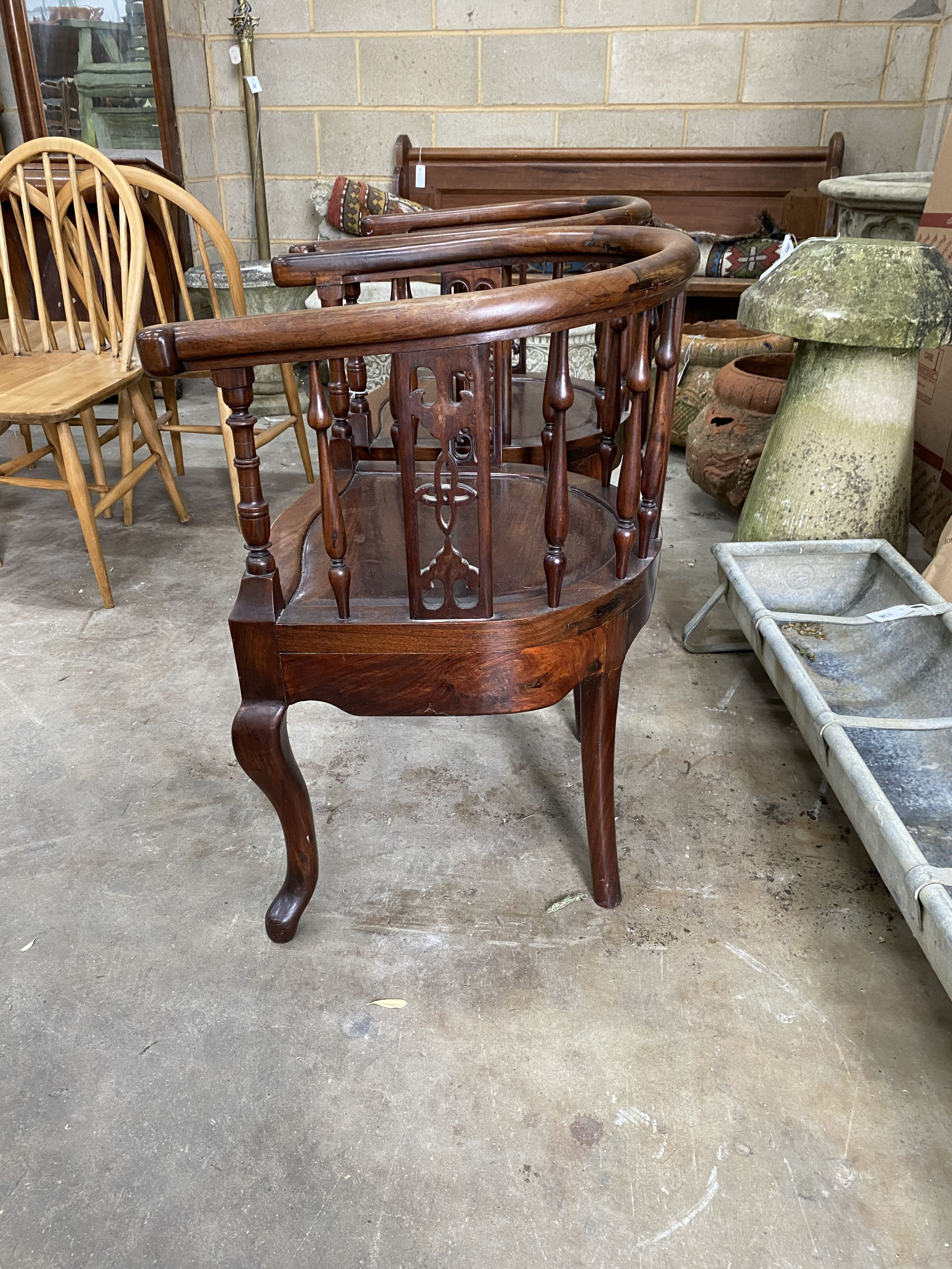 A pair of Chinese carved hardwood elbow chairs, width 55cm, depth 50cm, height 79cm